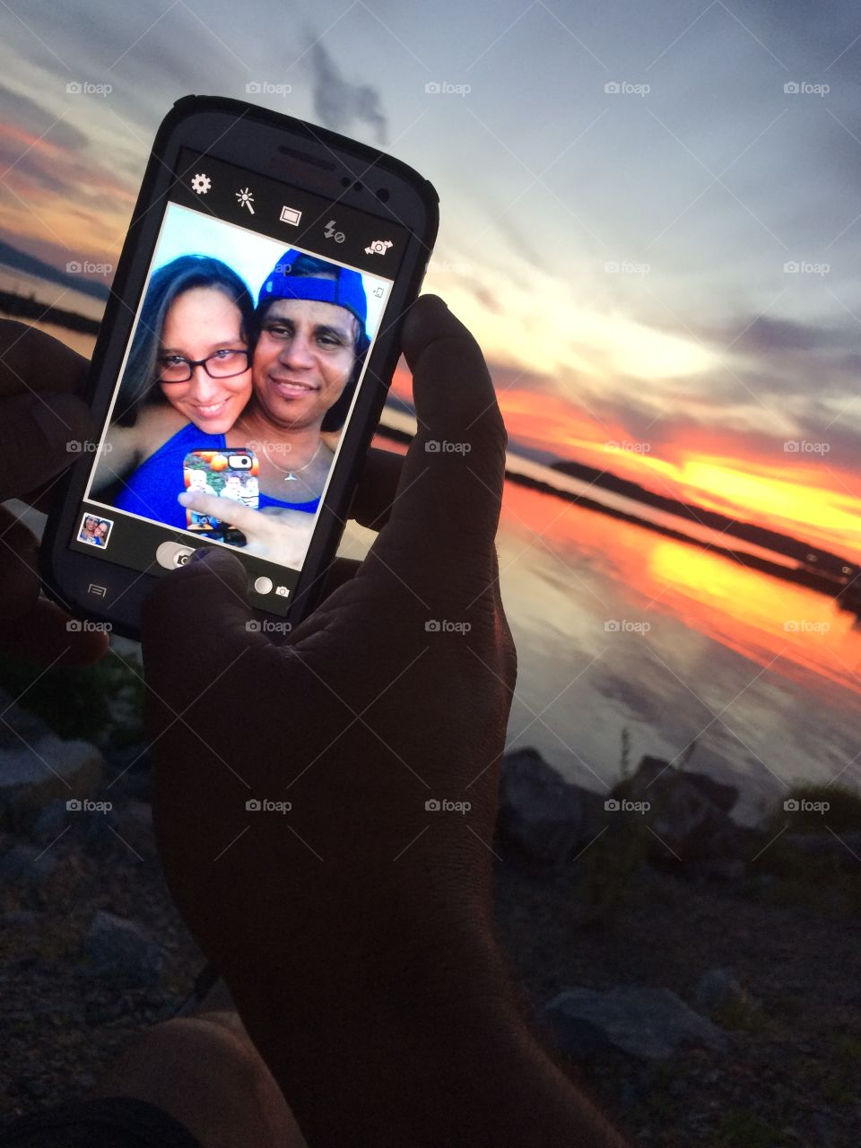 Sunset love . Lake Champlain, Vermont sunset. Couple taking pictures. 
