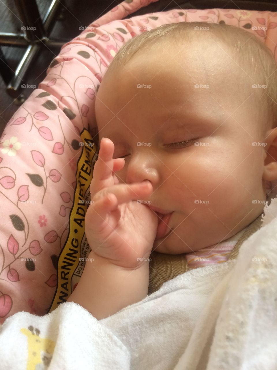 Little cute baby sucking thumb while sleeping