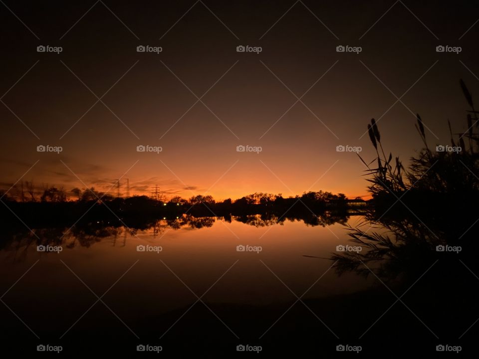 Night is near colours blooming to represent Night. Some high clouds making their presence low to the Horizon. 