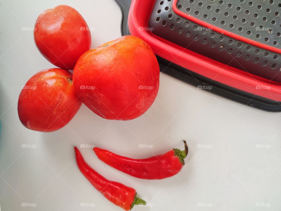 Red tomatoes 🍅 and Chili Peppers