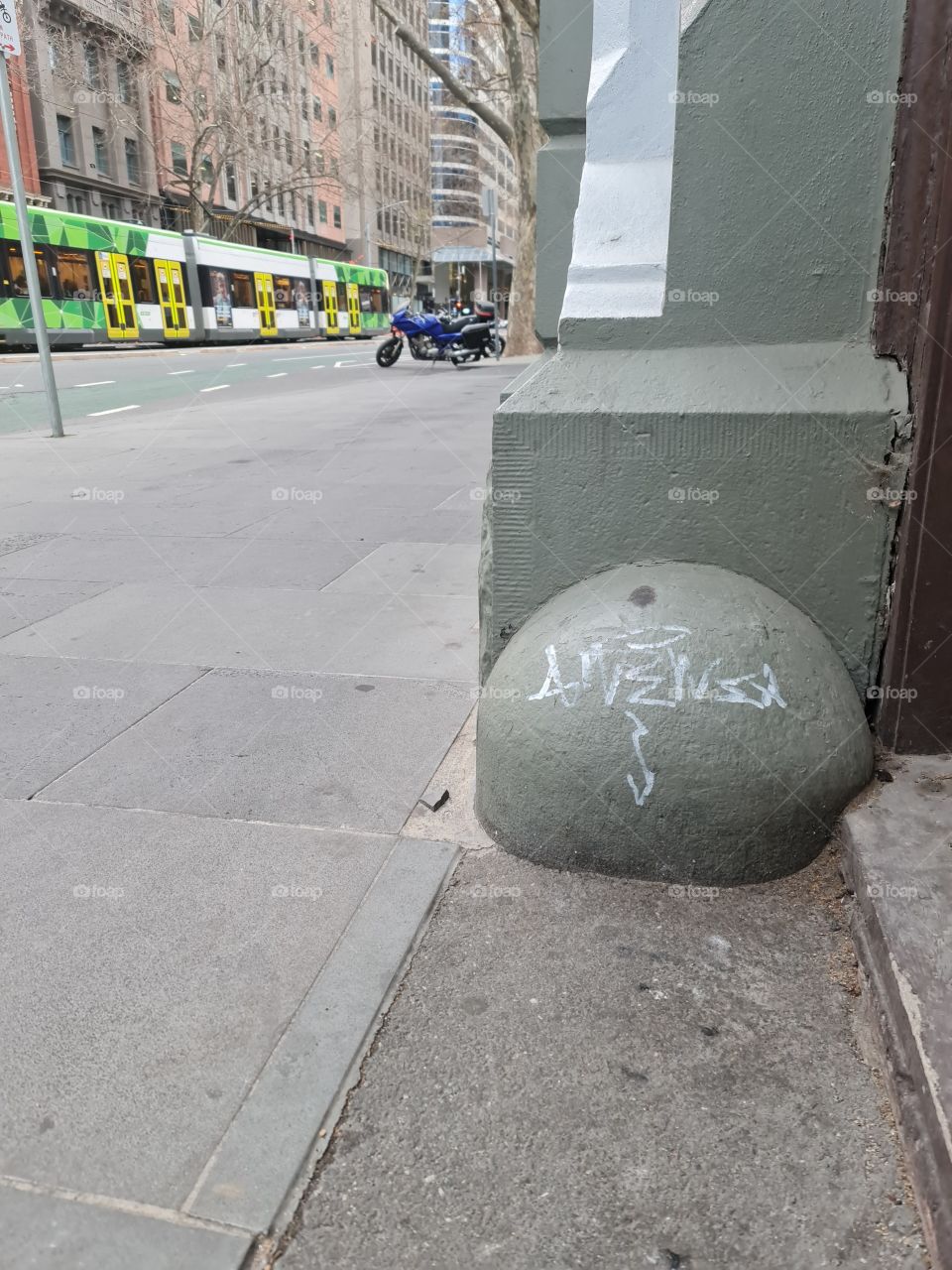 Melbourne city graffiti tag with a tram in the background