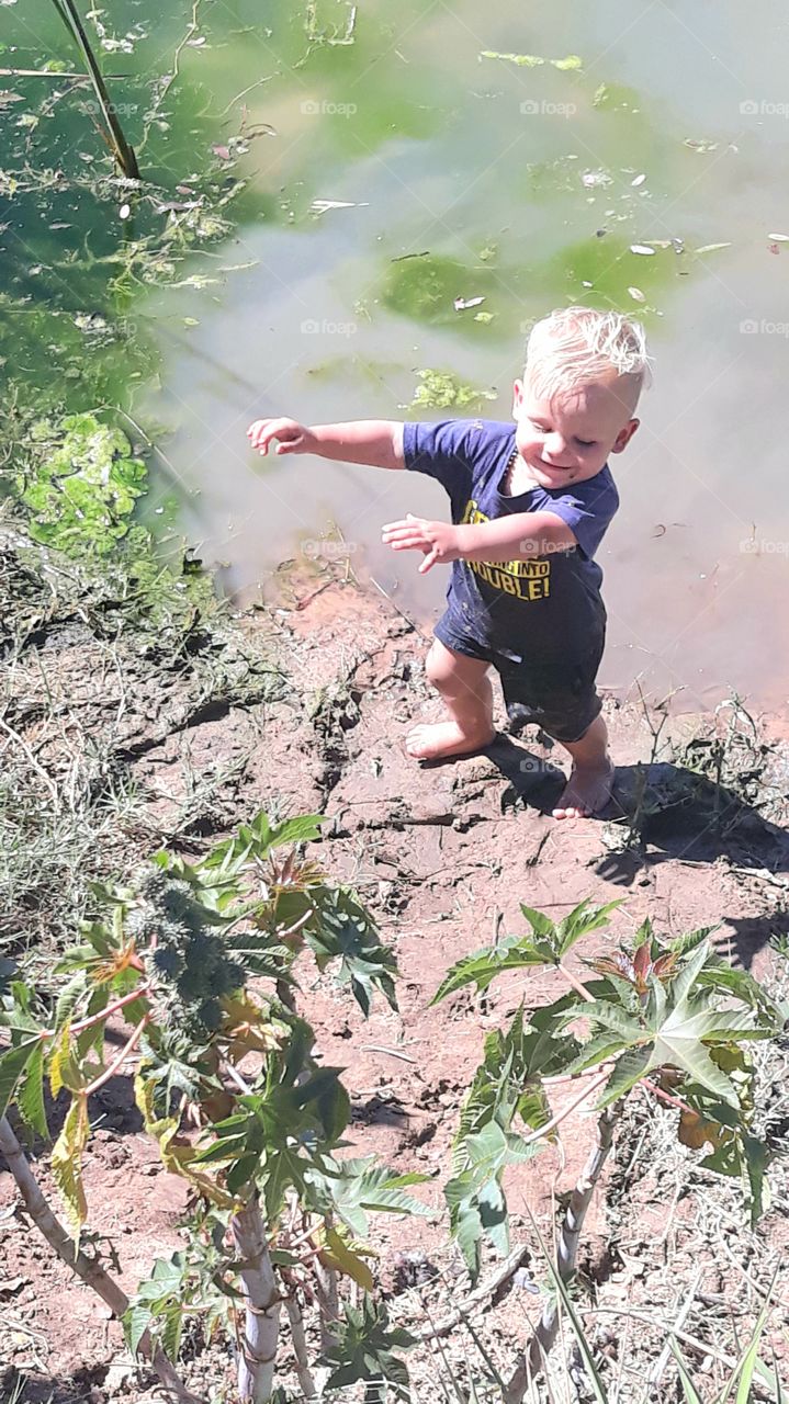 Little boy having fun at the dam