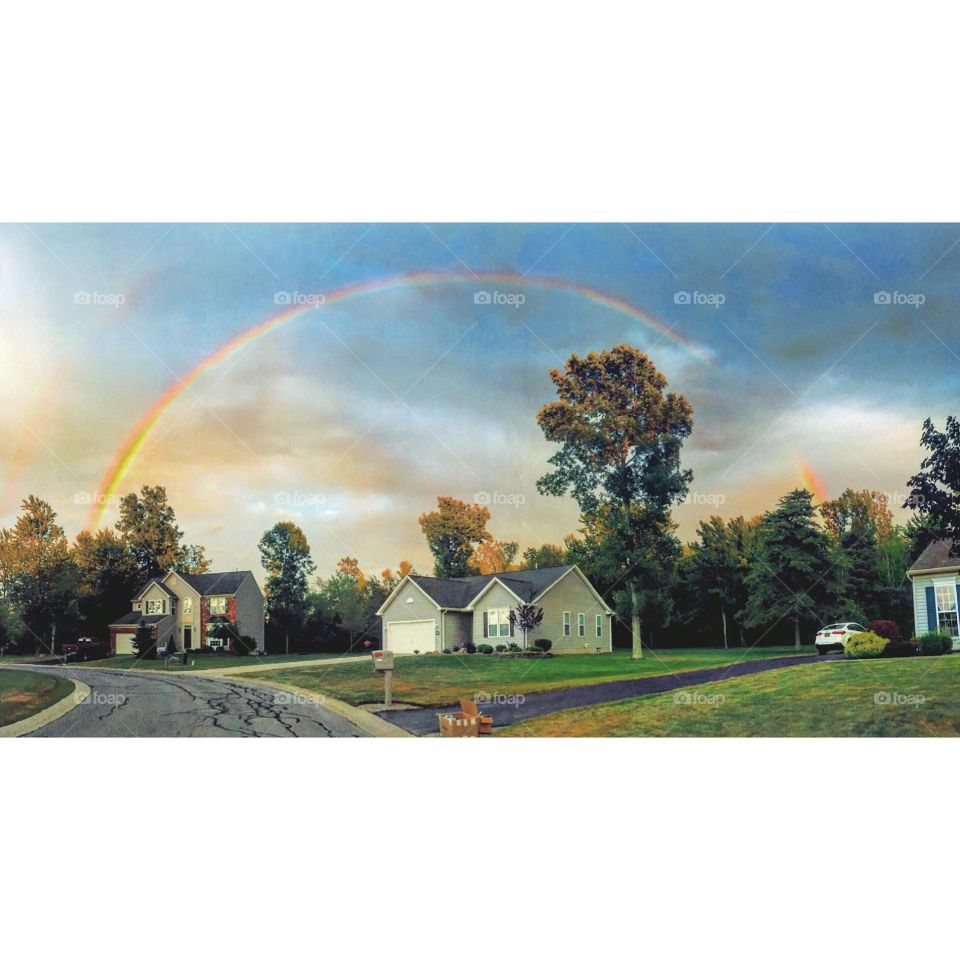 Double rainbow. A rainbow stretching across the sky