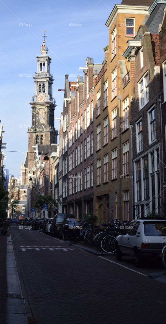 Street of Amsterdam and old church 