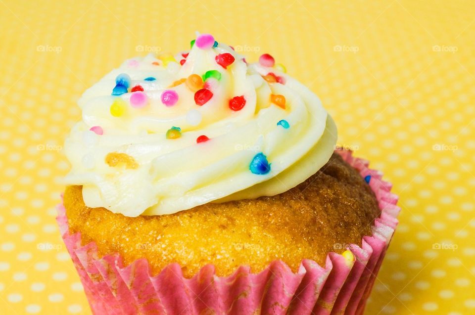 Cupcakes with yellow polka dot background 