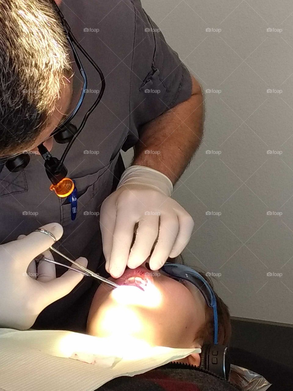 dentist pulling teeth