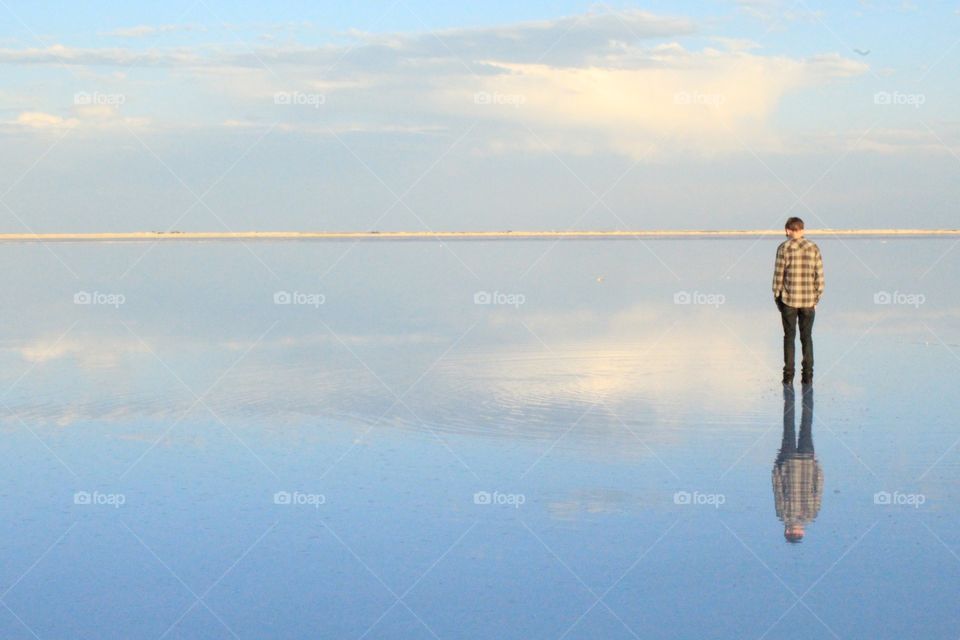 Refection of a man on lake