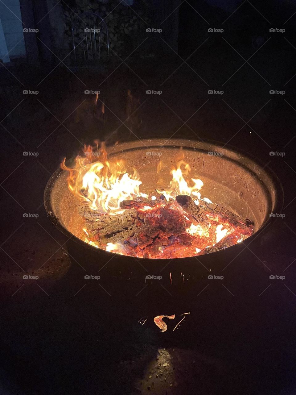 Wanted to get some burning, red, hot, coal pictures, from this Saskatchewan Rough Rider fan firepit, showing a little fire at night