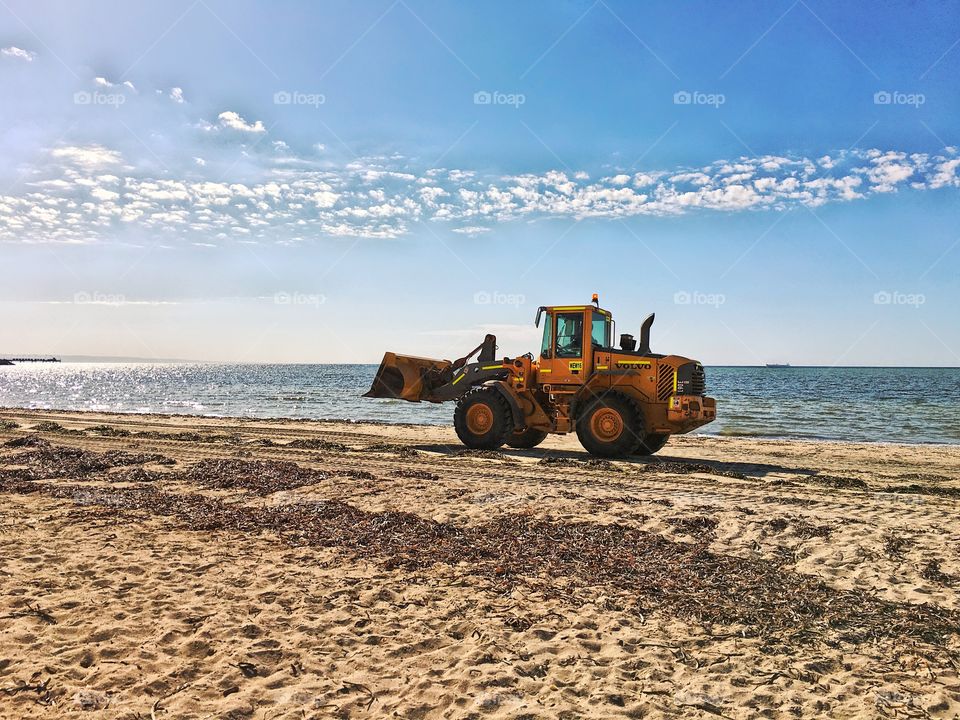 Volvo digger bulldozer on beach