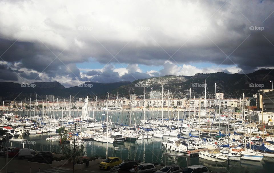 Sun breaks through the clouds to shine on the port of #Toulon