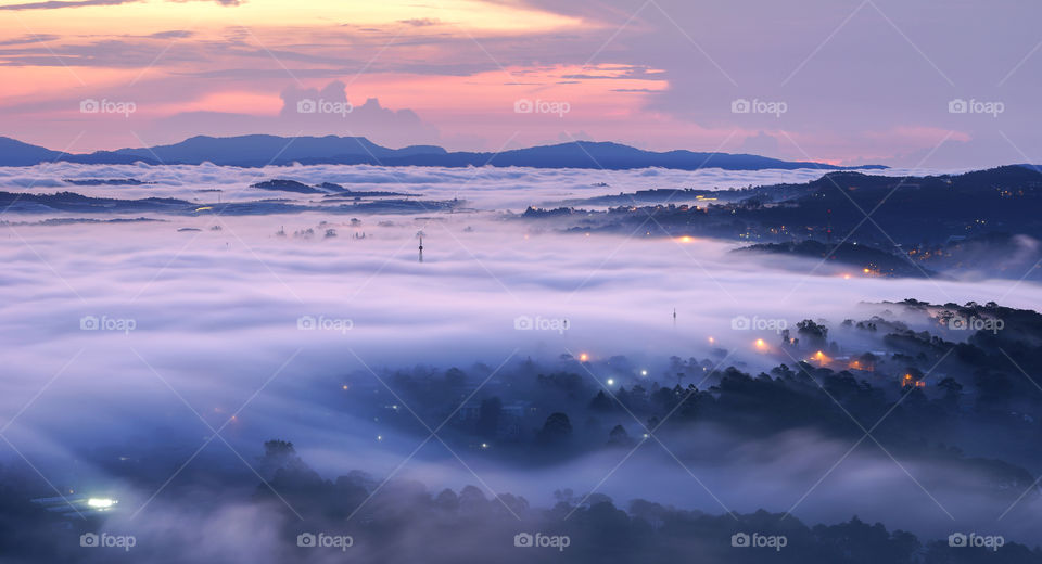 Foggy city in dawn