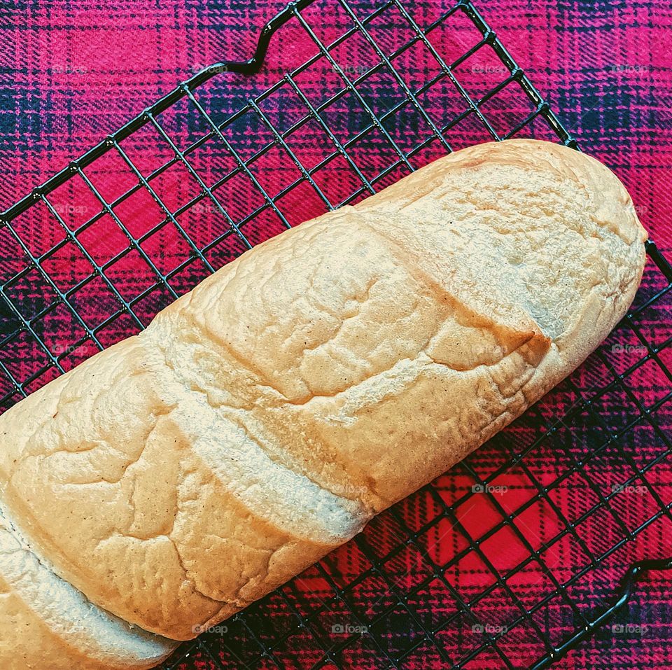 Freshly baked bread, homemade bread on a cooling rack, making fresh bread at home, baking bread at home, making bread at home, loaf of bread on cooking rack