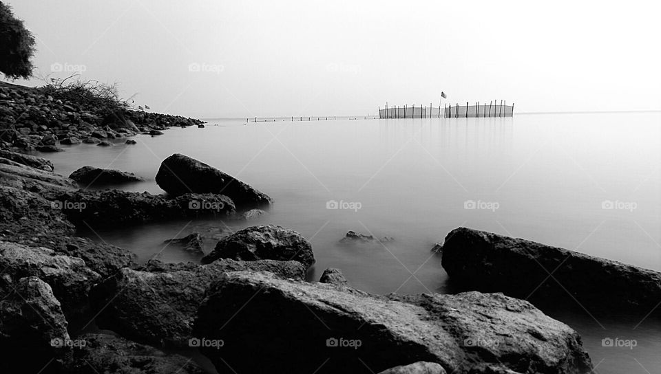 large rocks on the beach that are useful for breaking waves