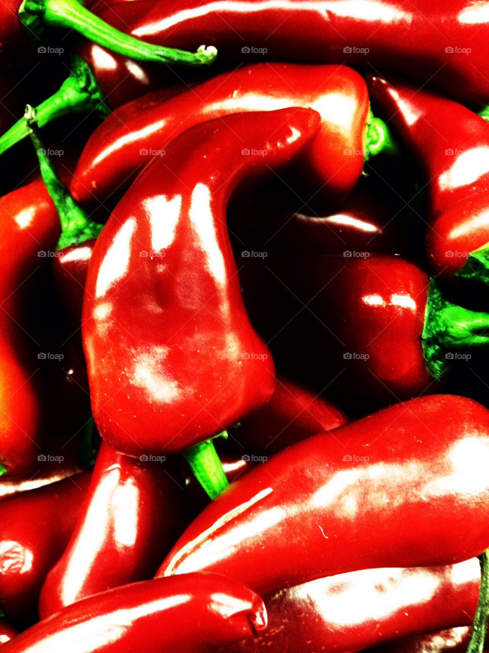 Shiny red spicy jalapeño peppers