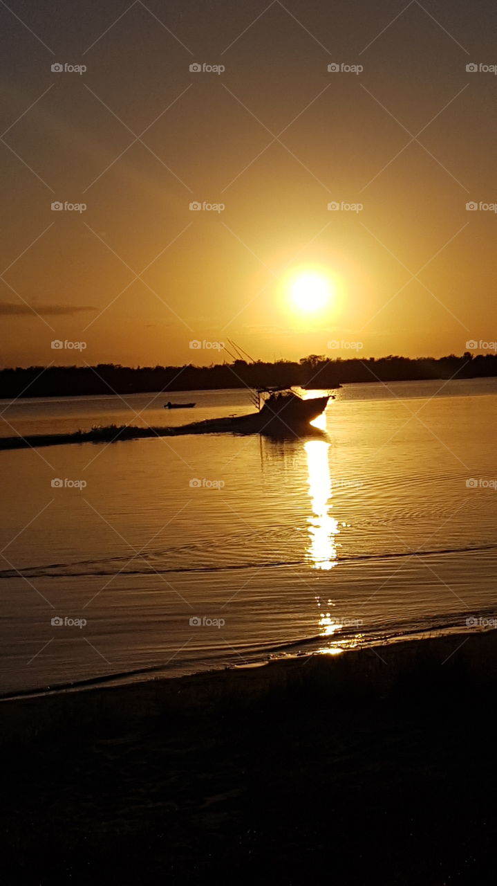 Watching the early Fisherman as the Sun Rises