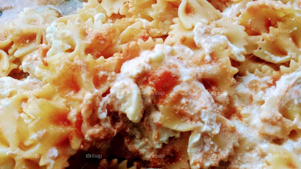 Butterflies pasta with tomato sauce and ricotta cheese