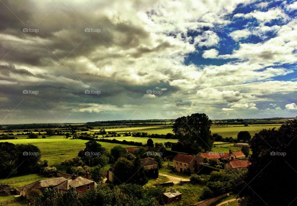 Watching the rain approaching over fields