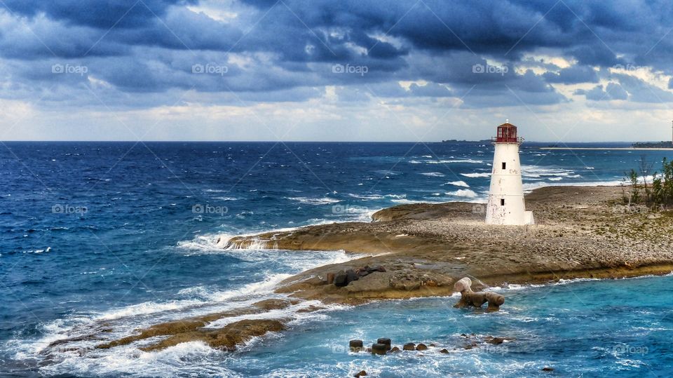 Caribbean Island Lighthouse Breakers waves Blue Water Shoals Shore sky