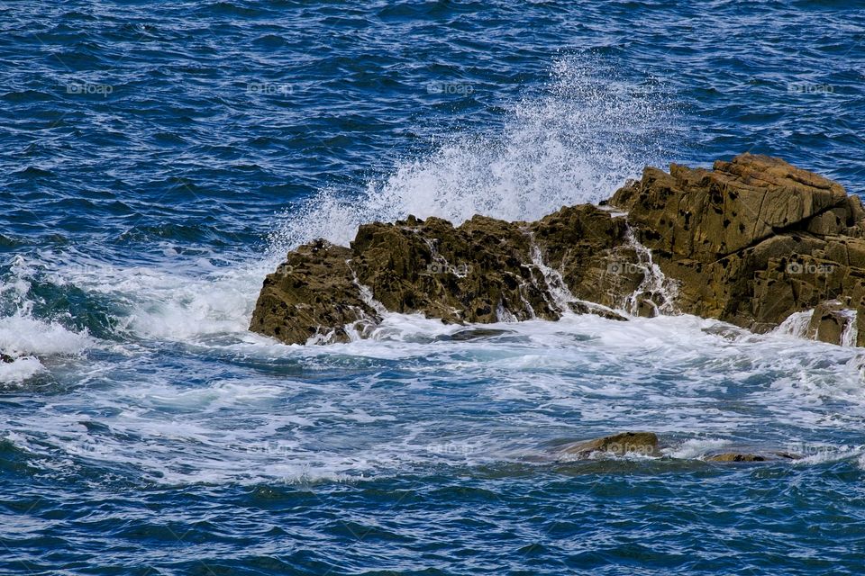 waves crashing on rocks