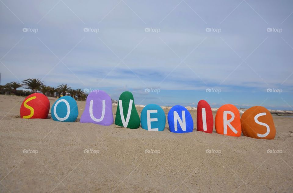 Souvenirs word on colourful stones