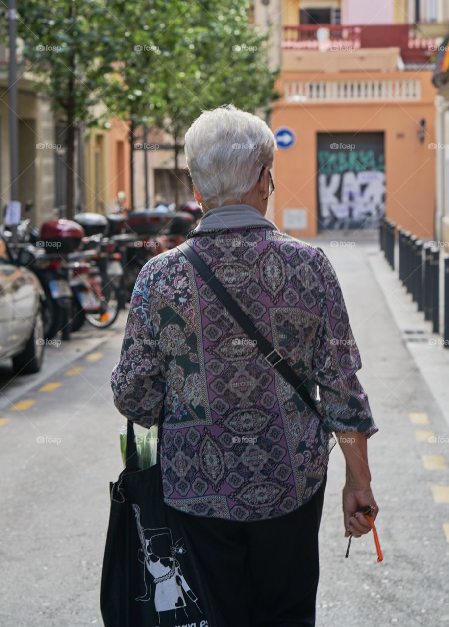 Elderly woman going shopping