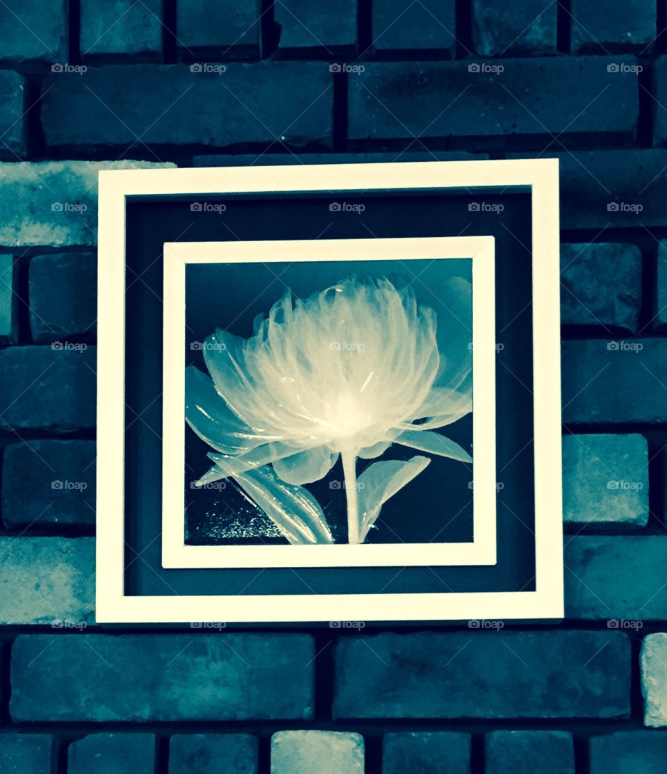 a  frame on the brick wall