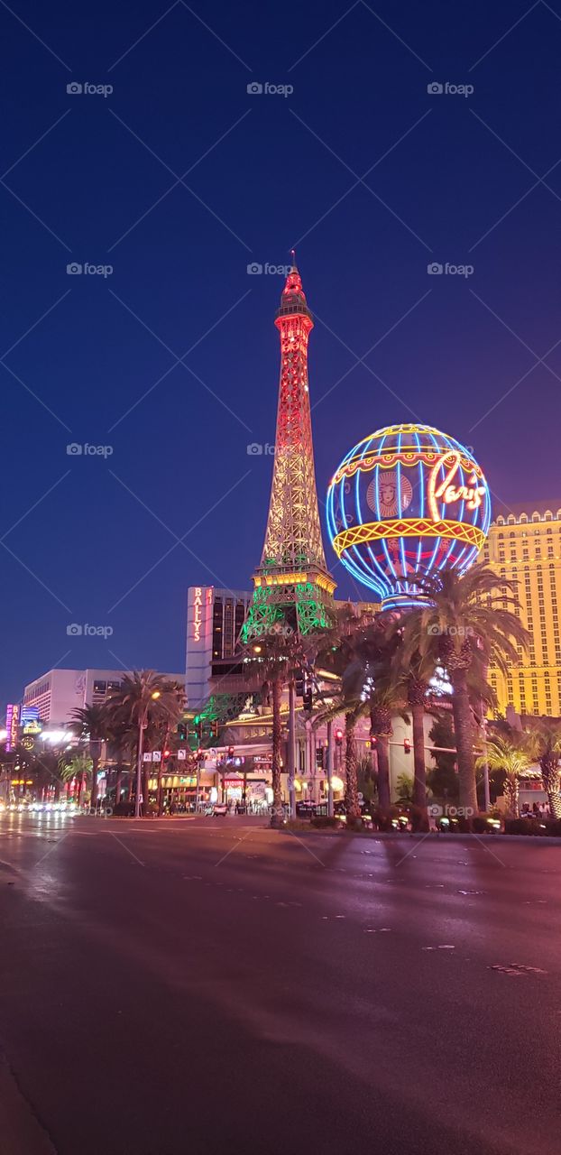 The Eiffel Tower all light up red/yellow/green at Paris Casino in Las Vegas NV