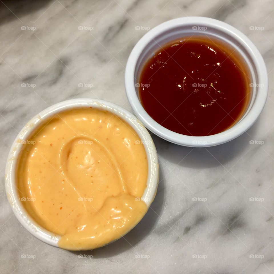 Spicy mayo and ketchup dips.