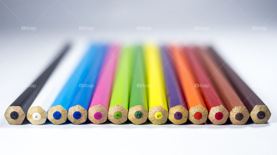 Arrayed colorful pencils close-up