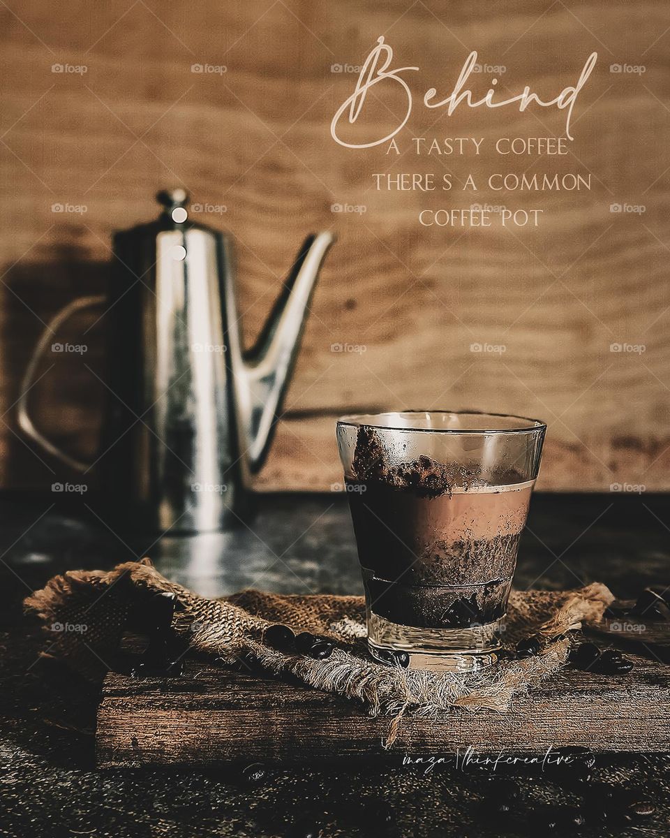 Mocha in a cup with a metal jug at the back and quote