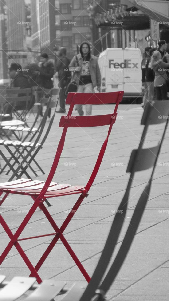 Bright Red Chair in the City on a Black and White Background