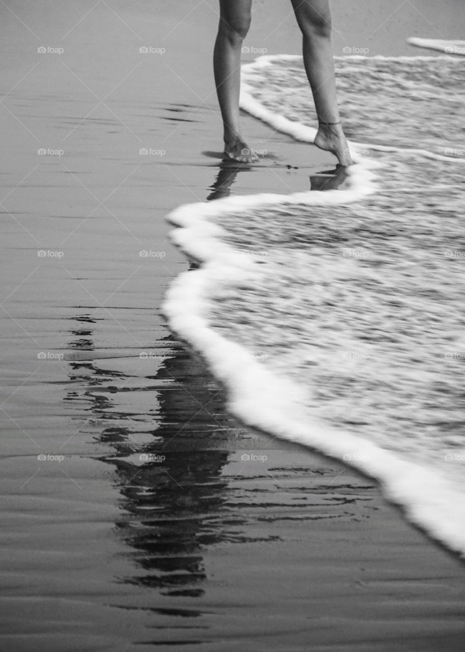 Feet in the sand, toes in the sea