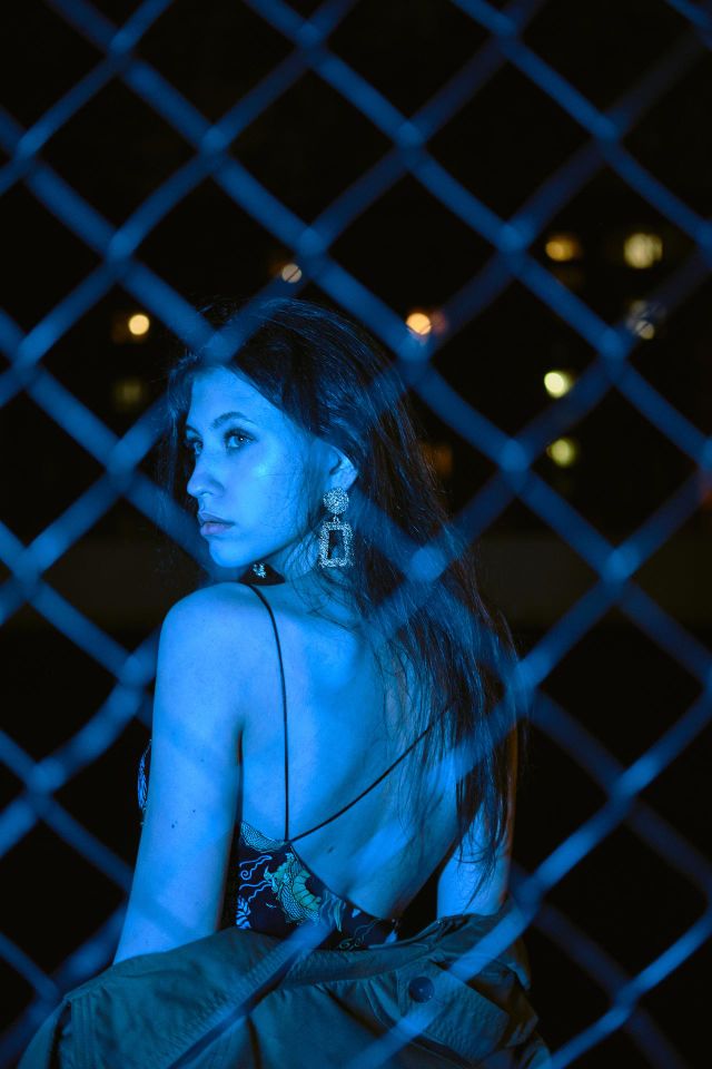Girl in blue street light