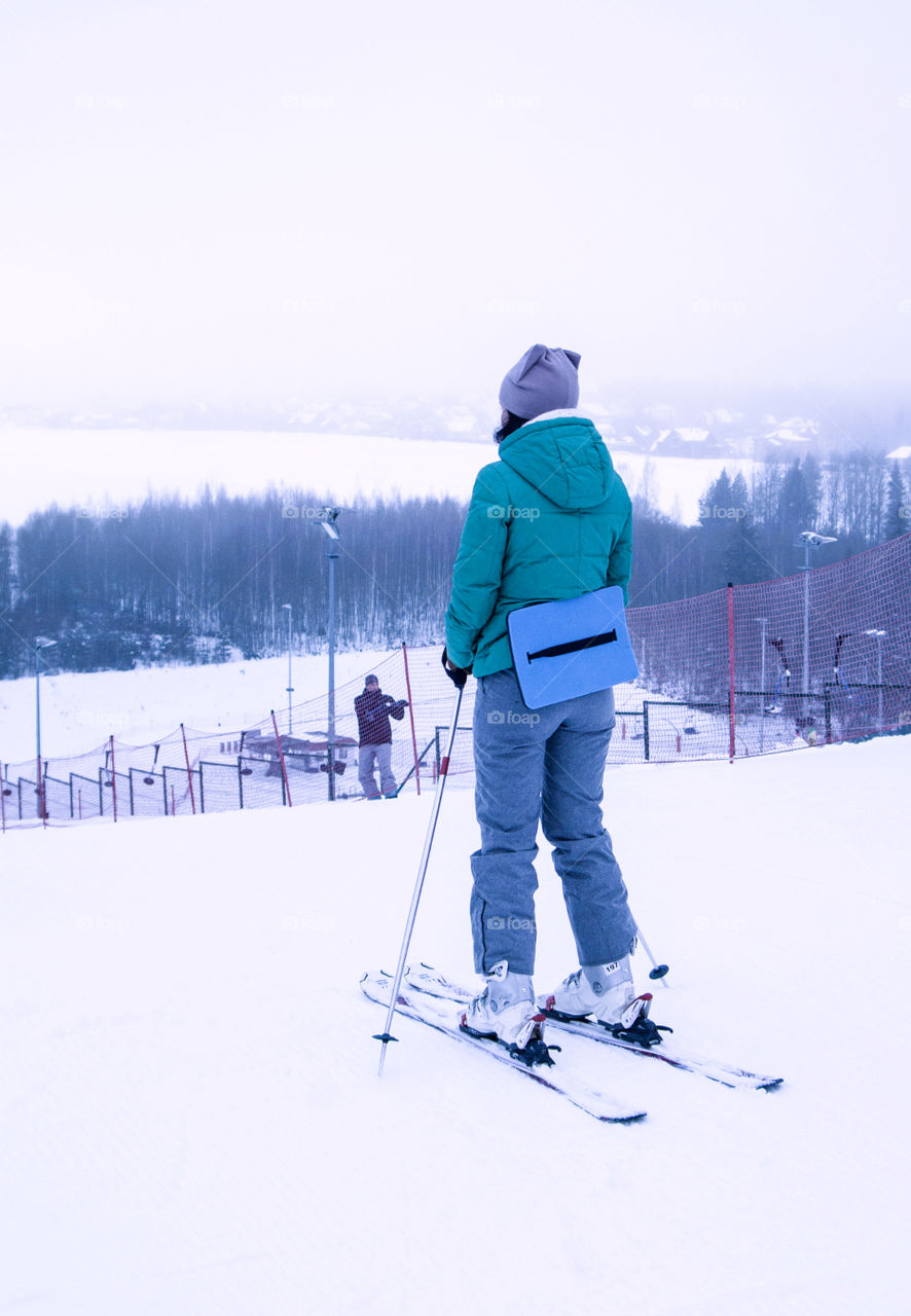 girl skiing down the mountain