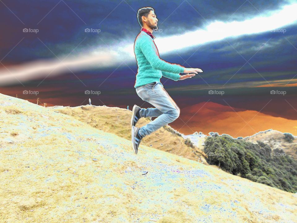 Man jumping over the mountain