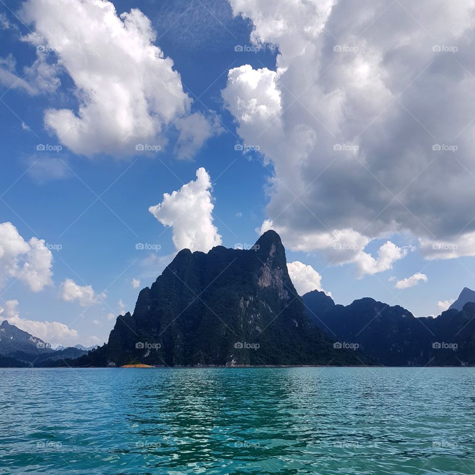 Scenic view of lake against mountains and sky