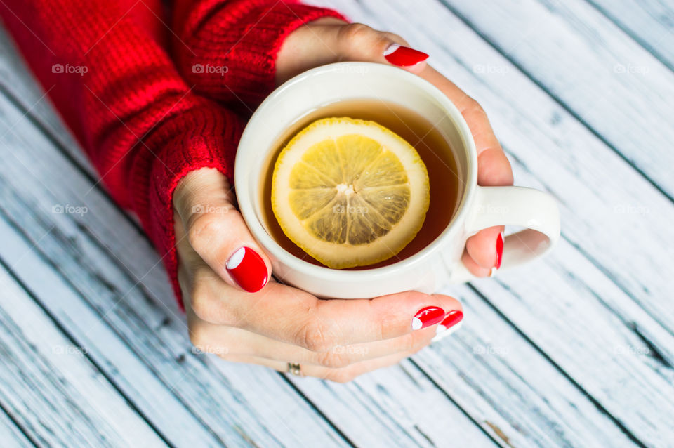 woman hand with cup of tea