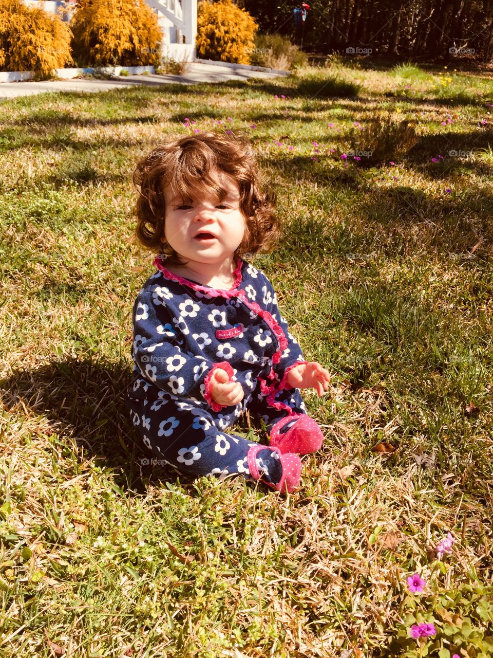 My baby sister in some grass