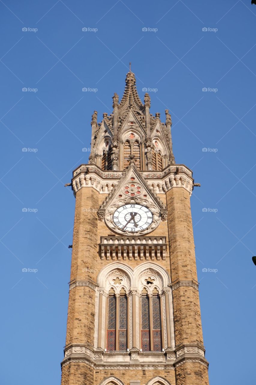 the clock tower near the oval maidan