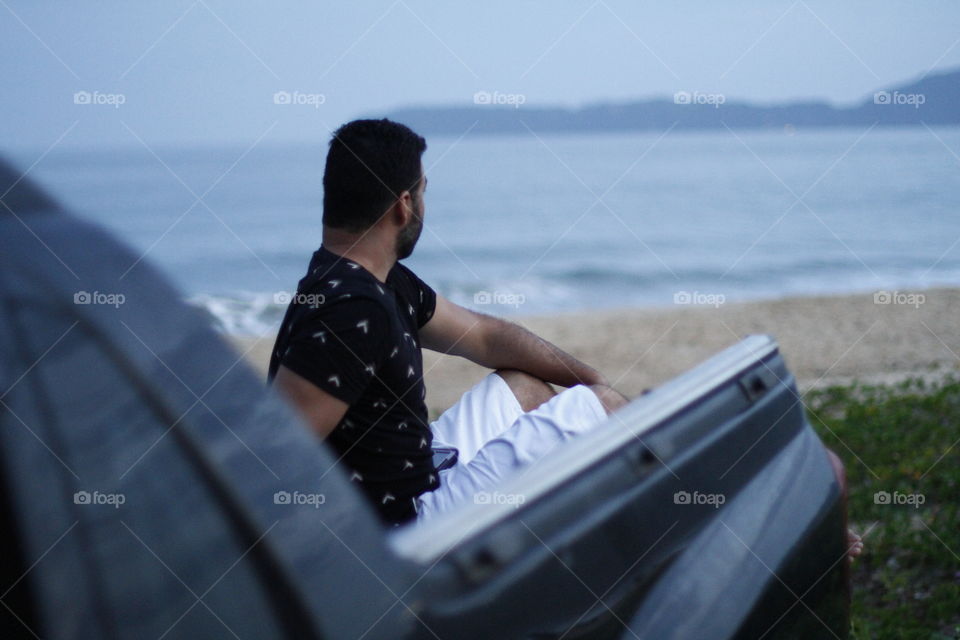 man sitting in his truck