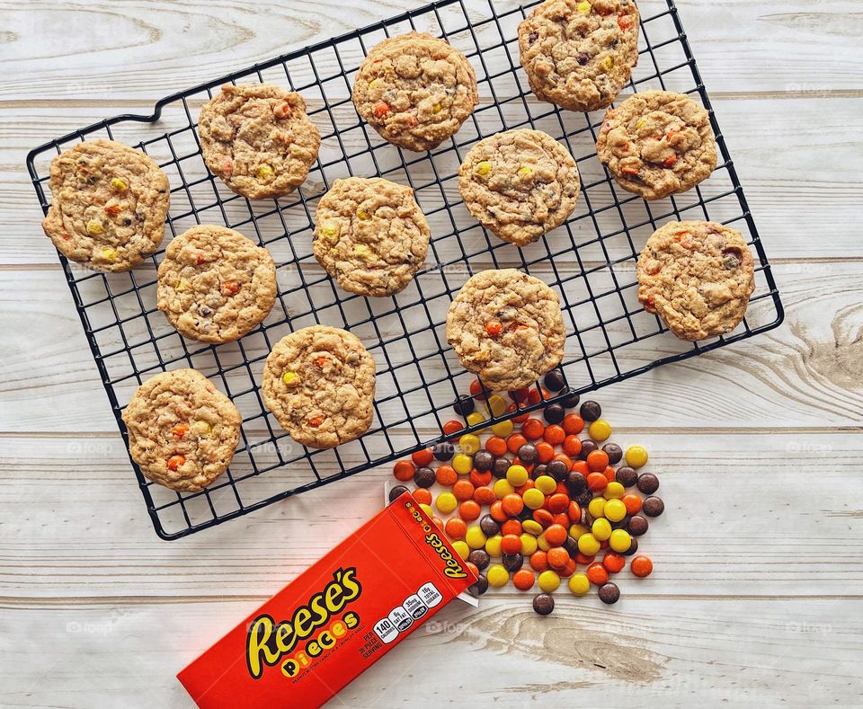 Homemade cookies with candy on table, Reese’s Pieces Chocolate Chip Cookies and Reese’s Pieces candy, treats on the table, food photography with a smartphone, candy and cookies, delicious treats for the kids, baking with children