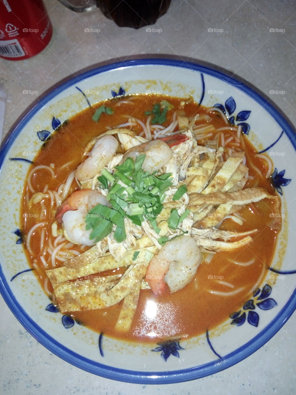 Laksa Sarawak, Sarawak famous dish, spicy noodle soup with shrimp paste ..

Laksa consists of rice noodles or rice vermicelli with shredded chicken, prawns and fried egg slices, served in spicy soup based on rich and creamy coconut milk and mix with hot and spicy paste..