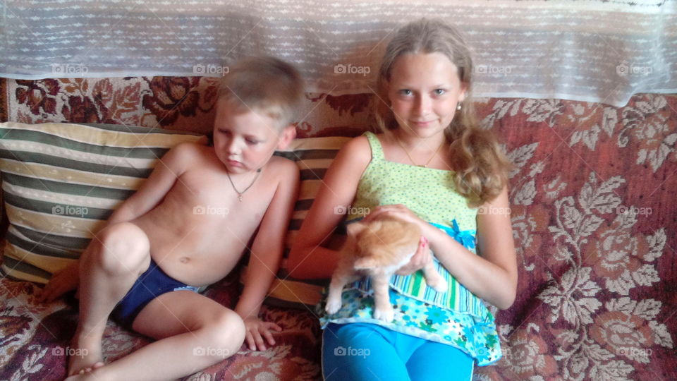 children and kitten