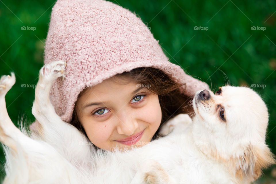 Little girl with her friend dog