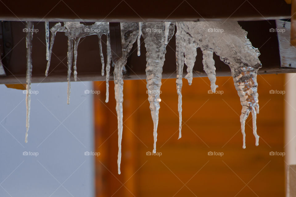 Icicle hanging from roof