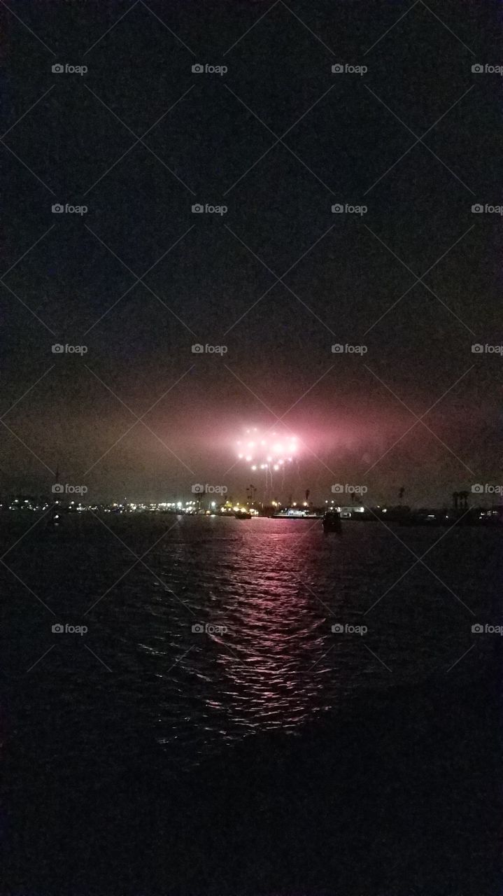 Fireworks in the sky over the Pacific Ocean, on a 4th of July chilly night. America the Beautiful! Born in the USA . I heart America
