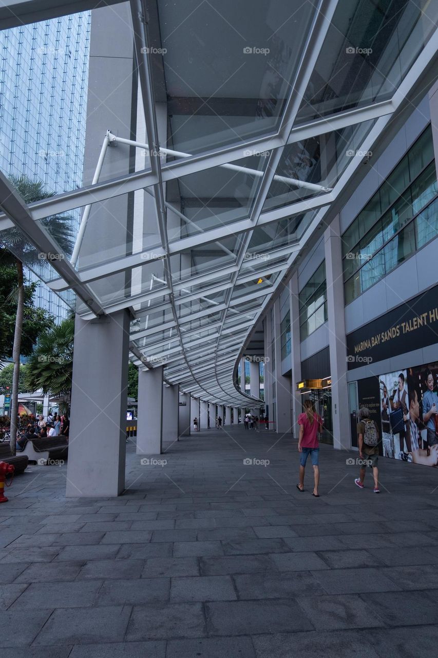 the glass roof over the sidewalk