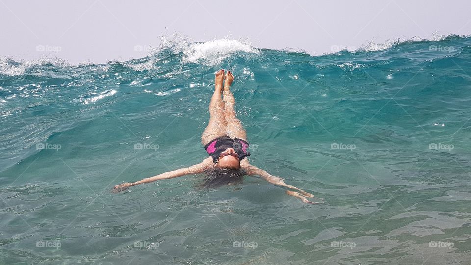 woman in atlantic ocean on tenerife canary island in Spain
