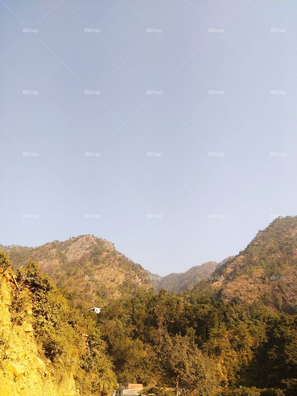 Sunlit hills on the way to Deoprayag, land of gods