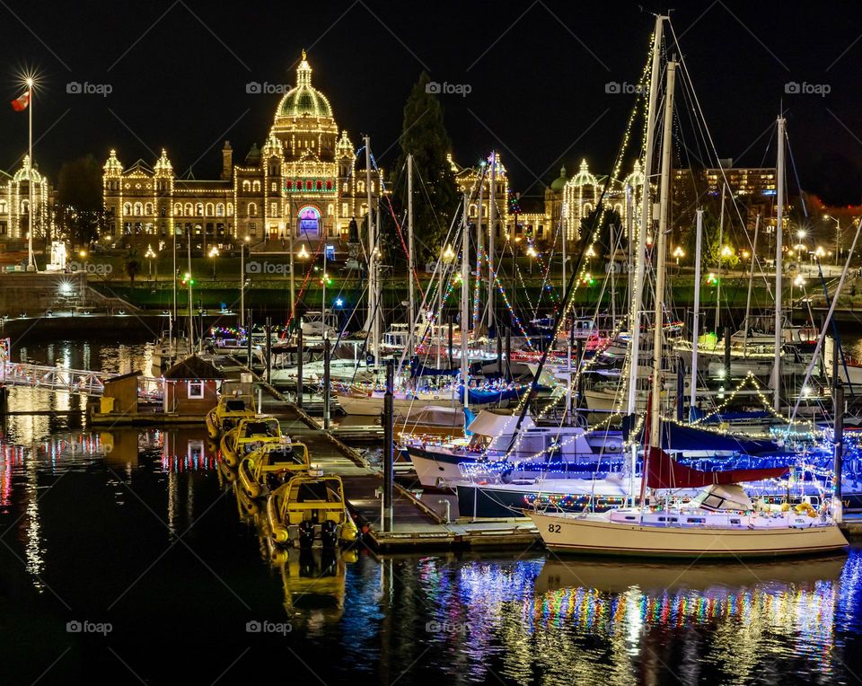 Historic government building and sailboats in harbour - Victoria Canada 